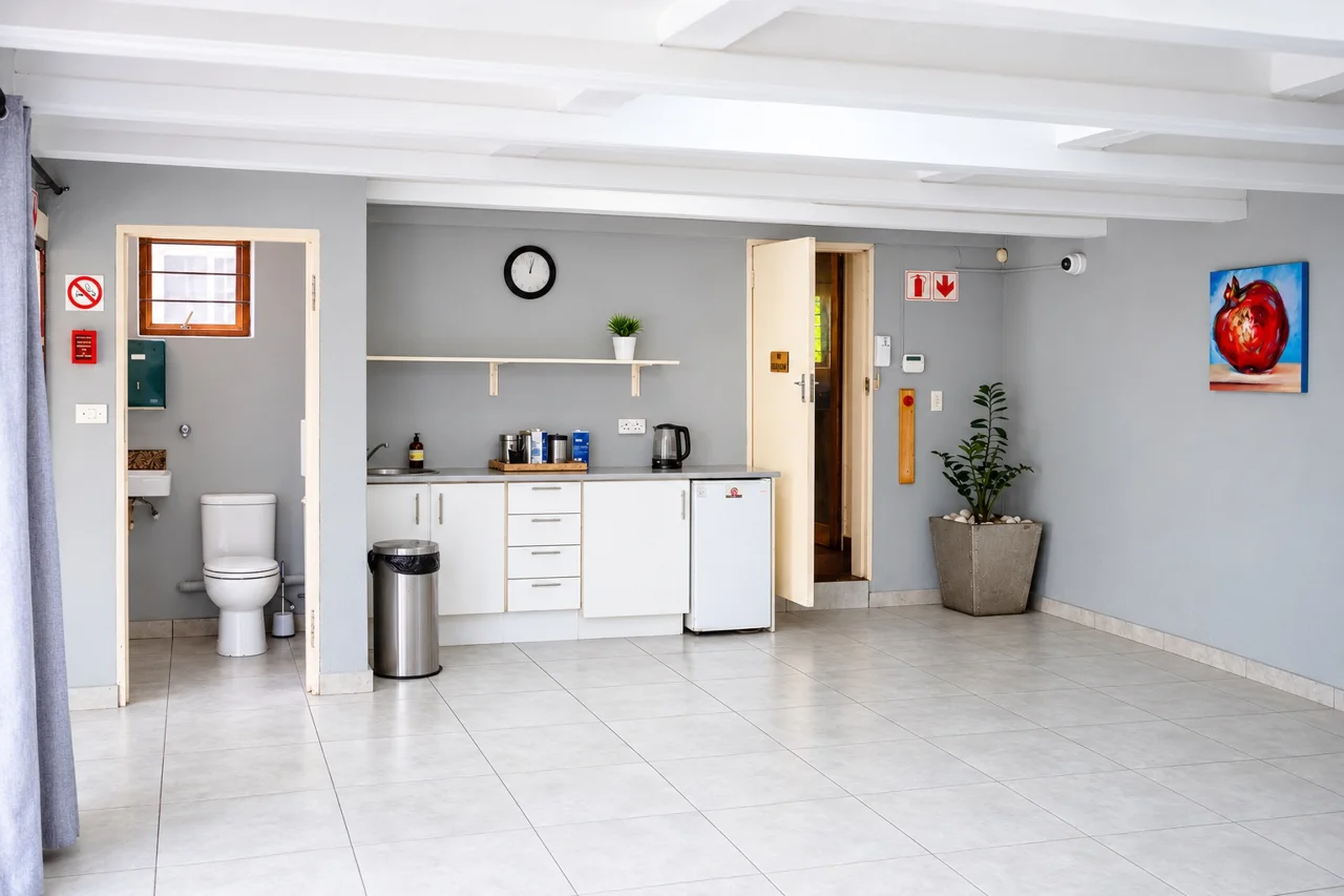 Bright shared space with a kitchenette at Cambridge House