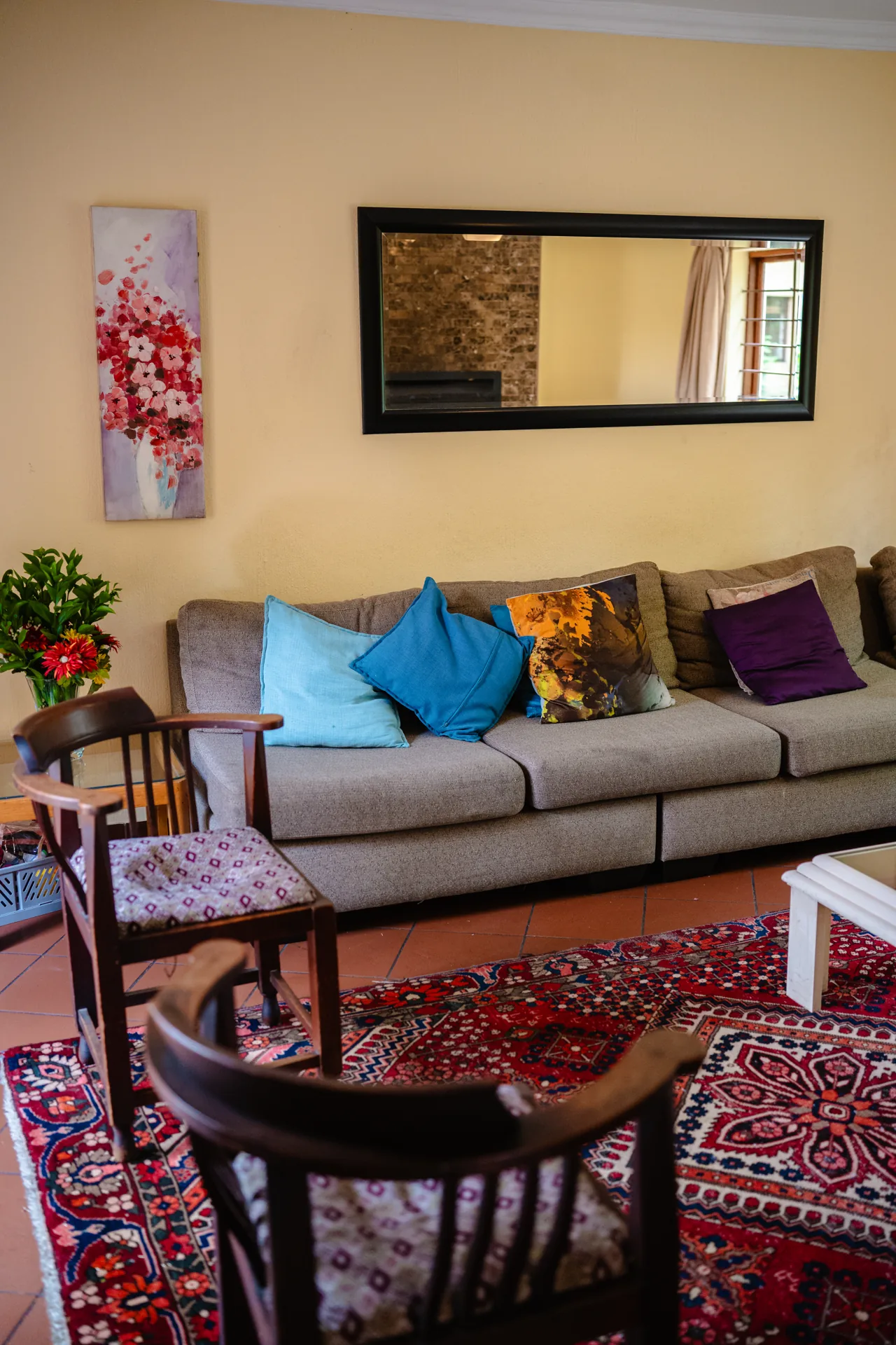 Cambridge House lounge with colourful cushions and comfortable seating