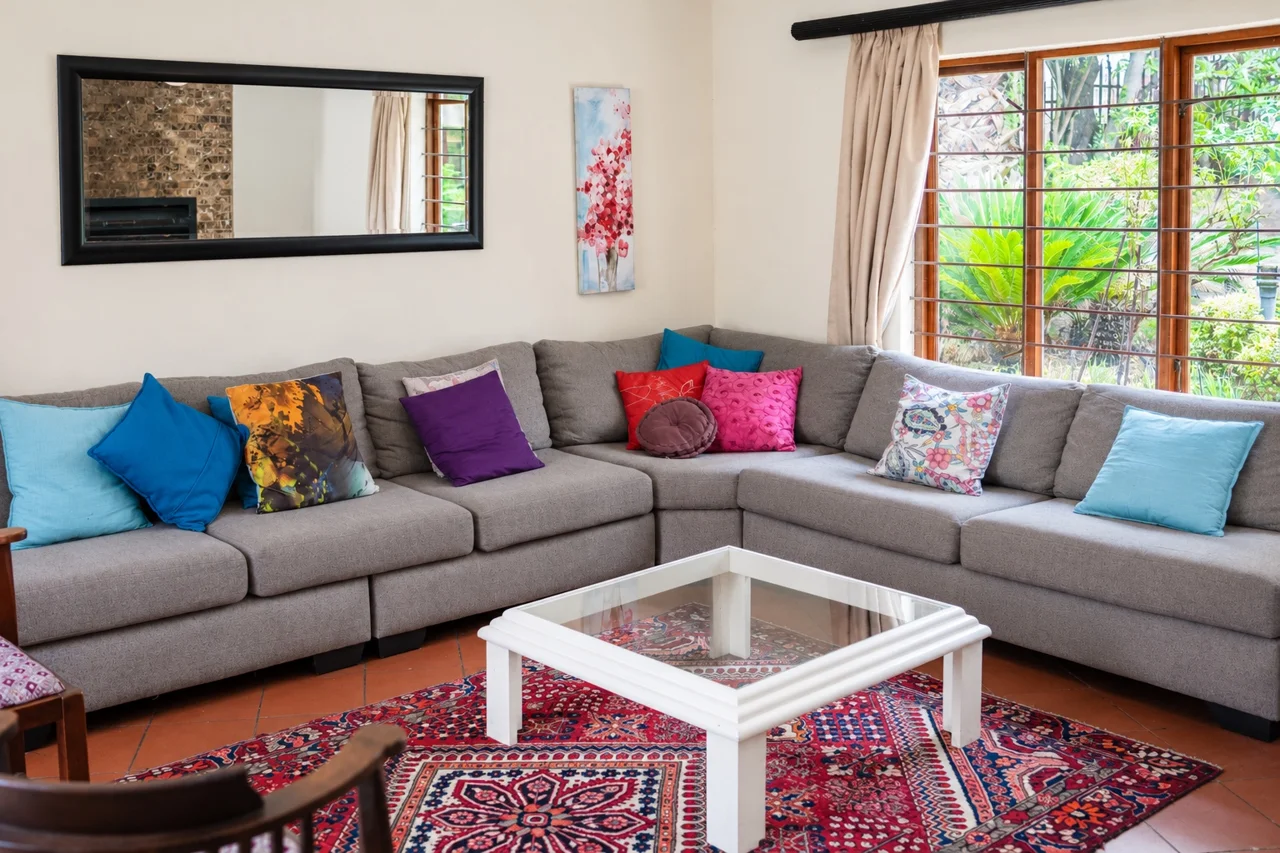Cambridge House lounge with colourful cushions and comfortable seating